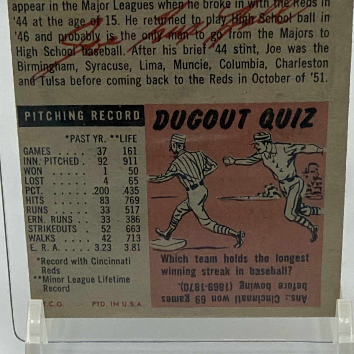 Close-up of vintage statistics and text on the back of Joe Nuxhall baseball card
