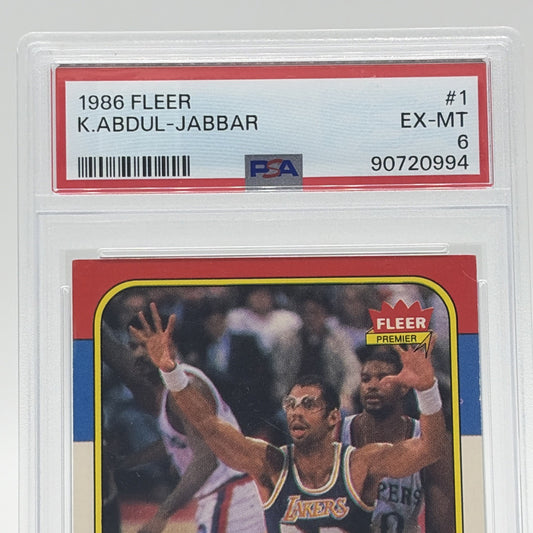 Close-up of the PSA EX-MT 6 certification label on a 1986 Fleer Kareem Abdul-Jabbar #1 basketball card.