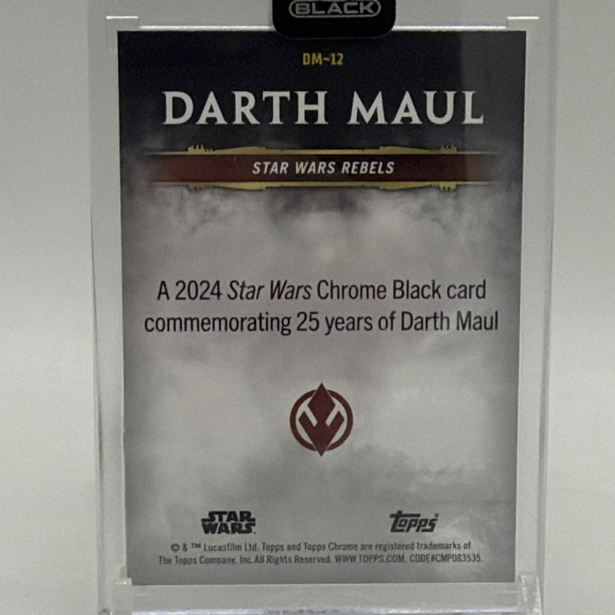Reverse of 2024 Topps Chrome Black Darth Maul DM-12 trading card featuring character description and Star Wars branding