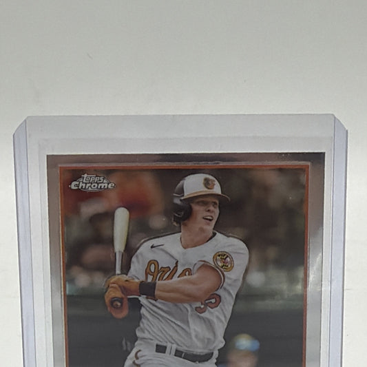 Close-up of Adley Rutschman 2023 Topps Chrome rookie card #1 with RC logo and All-Star Rookie trophy