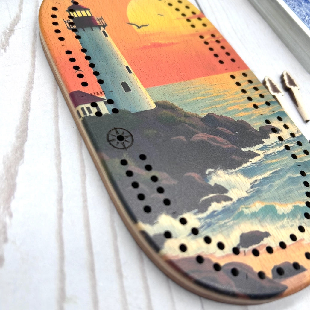 mini travel cribbage board, wilderness cribbage game, pocket cribbage set, Cast and Carve cribbage, wildlife cribbage board, UV printed cribbage board, solid wood cribbage set, eco friendly travel game, Maine-made game board lighthouse