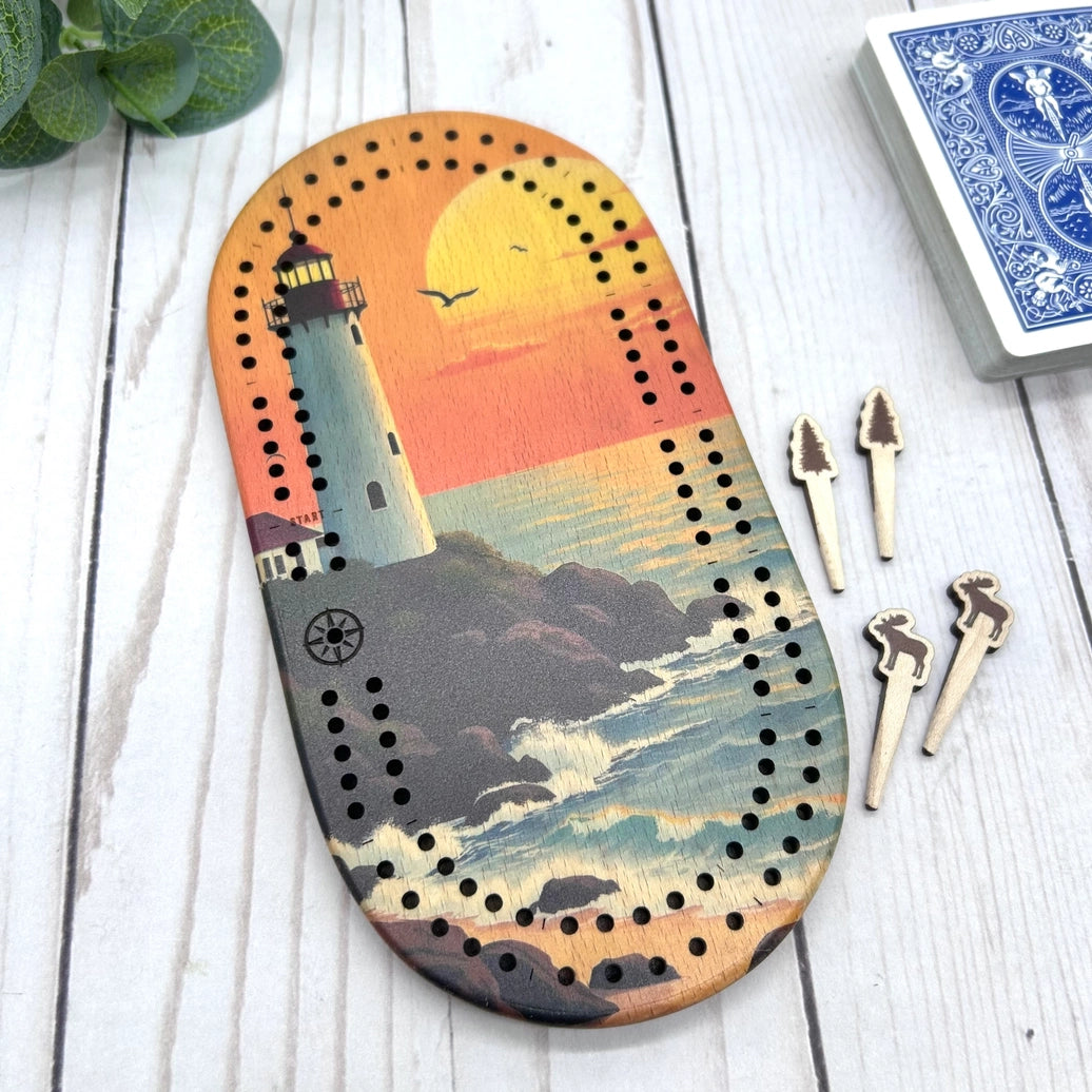 mini travel cribbage board, wilderness cribbage game, pocket cribbage set, Cast and Carve cribbage, wildlife cribbage board, UV printed cribbage board, solid wood cribbage set, eco friendly travel game, Maine-made game board lighthouse