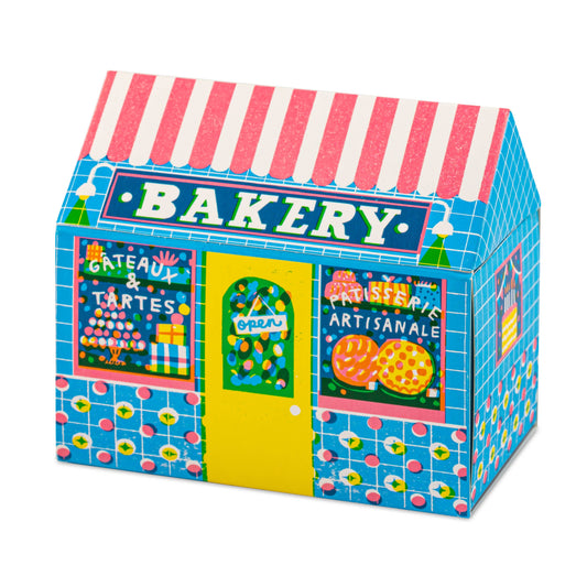 Bakery House matchbox, house-shaped safety matches, The Printed Peanut illustration, bakery shopfront matchbox design, pastry-themed gifts, foodie gift ideas, Archivist House Match collection, whimsical illustrated matchbox, UK-made safety matches, kitchen décor accessories, collectible matchbox art, Rogue & Rye curated gifts, colorful bakery artwork, artisan matchboxes.