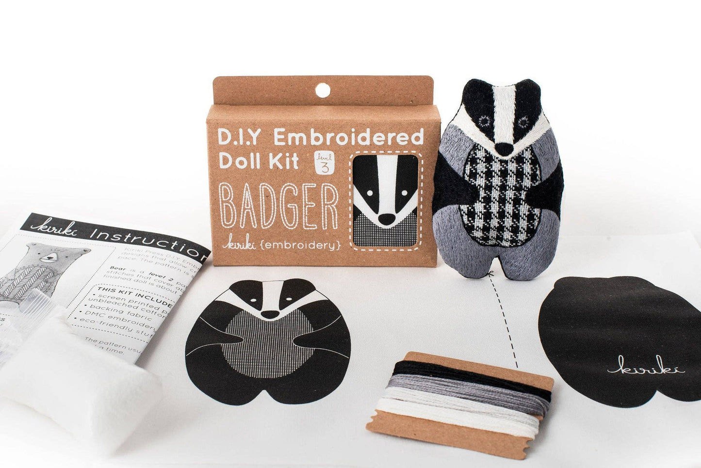 badger embroidery kit, embroidered doll craft kit, Kiriki Press embroidery, Level 3 embroidery pattern, animal embroidery project, hand embroidery for beginners, stitched badger plush, screen printed embroidery fabric, DMC floss kit, mindful stitching craft