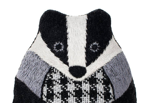 badger embroidery kit, embroidered doll craft kit, Kiriki Press embroidery, Level 3 embroidery pattern, animal embroidery project, hand embroidery for beginners, stitched badger plush, screen printed embroidery fabric, DMC floss kit, mindful stitching craft