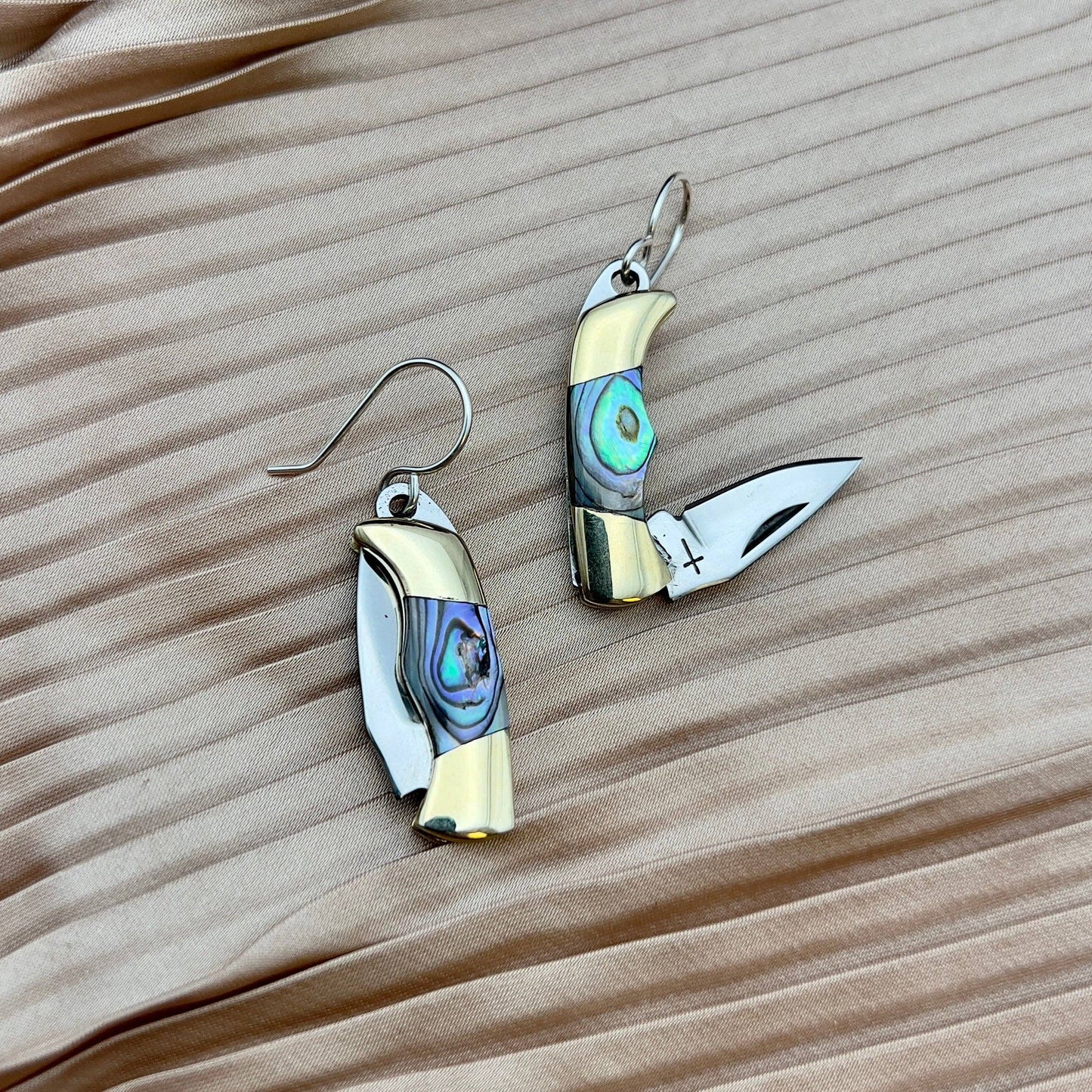 abalone knife earrings, billie mini knife earrings, functional knife earrings, silver mini blade earrings, abalone jewelry with blade, real knife earrings, abalone pocket knife earrings, rogue aesthetic earrings, sterling silver ear wire earrings, unique abalone inlay earrings, edgy statement earrings, utility jewelry earrings, pocket knife fashion, fantasy inspired jewelry, knife earrings, gift