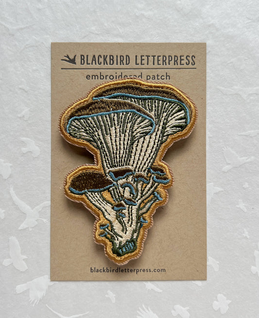 oyster mushroom patch, embroidered mushroom patch, fungi iron-on patch, mushroom sew-on patch, woodland embroidery patch, textured mushroom applique, backpack mushroom patch, jean jacket patch, nature lover gift, artisan embroidered patch, blackbird letterpress patch, fungi fashion accessory, cottagecore mushroom patch, rogue & rye patch collection, embroidered oyster mushroom