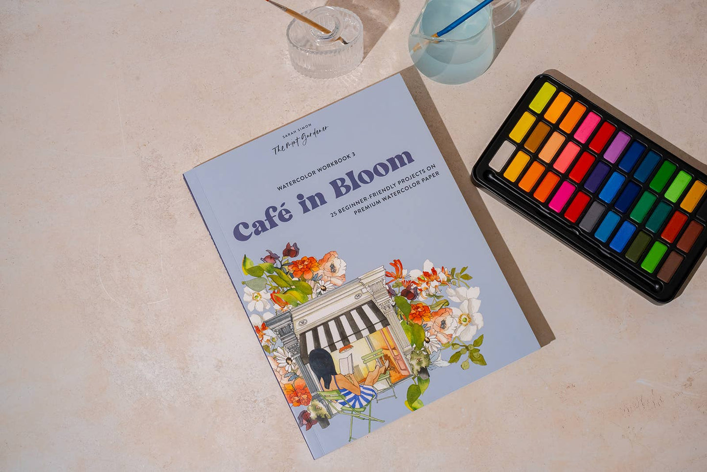 café watercolor workbook, garden watercolor book, beginner watercolor projects, Sarah Simon watercolor book, watercolor painting for adults, paint-in watercolor journal, floral watercolor scenes, cozy art projects, watercolor café illustrations, botanical watercolor practice