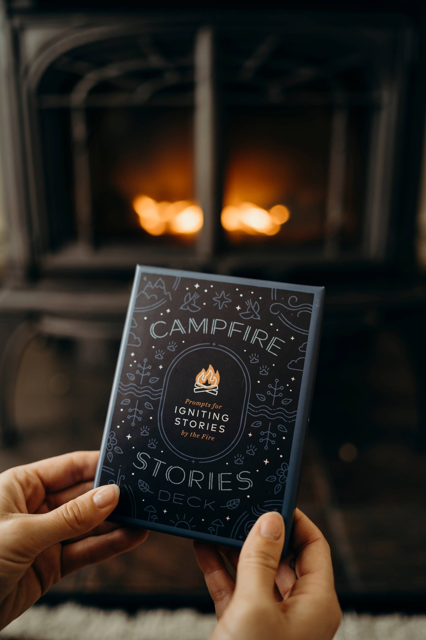 campfire stories deck, storytelling prompt cards, family campfire game, story cards for all ages, connection games for families, story starters deck, outdoor activity cards, camping conversation game, screen-free campfire fun, icebreaker card game, storytelling game for kids and adults, backyard game ideas, travel-friendly storytelling prompts, meaningful family activities, story game for group bonding