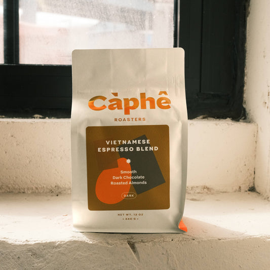 Vietnamese coffee blend, traditional Vietnamese espresso, Càphê Roasters coffee, dark roast whole bean, strong Vietnamese coffee, bold smooth coffee, Vietnamese espresso blend, ca phe sua coffee, dark chocolate coffee, roasted almond coffee, Lam Dong Vietnam beans, authentic Vietnamese brew, 12oz dark roast coffee, Southeast Asian coffee, three-part roast coffee