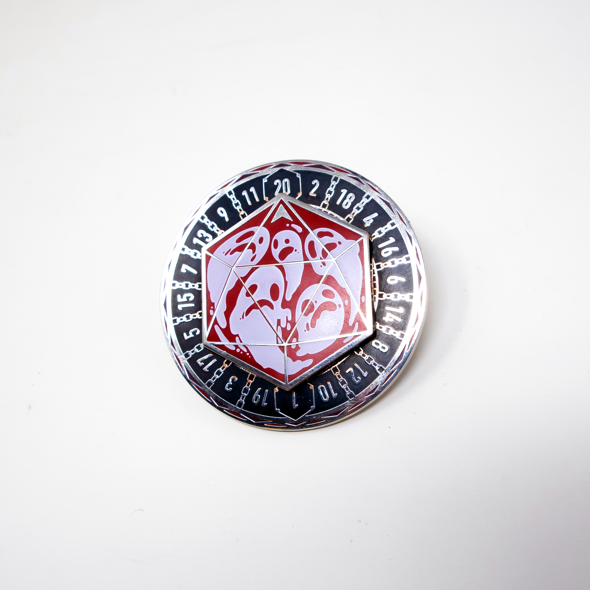 Round Fablemaker Donjon enamel spinner pin shown against a white background