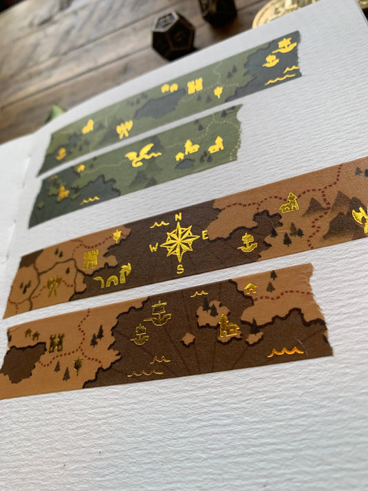 fantasy map washi tape, gold foil washi tape, D&D journal accessories, map design washi, RPG washi tape, character sheet decoration, eco-friendly washi tape, travel journal tape, parchment-style washi, green blue washi tape, brown washi tape, worldbuilding stationery, fantasy-themed washi, scrapbooking tape, biodegradable rice paper tape