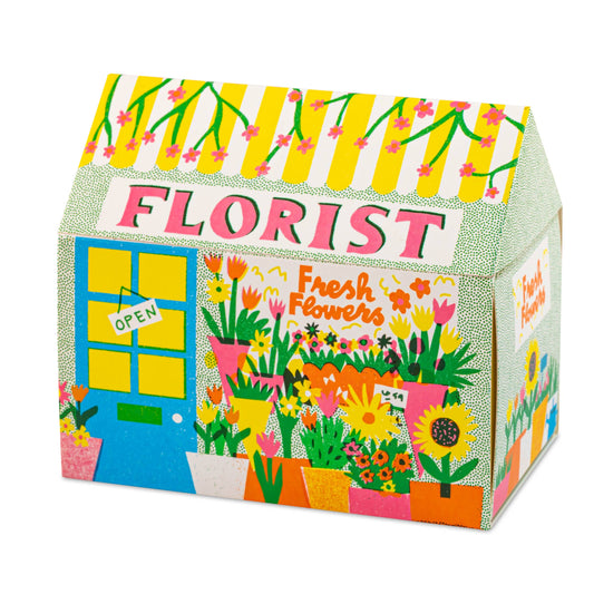 Florist House matchbox, house-shaped safety matches, The Printed Peanut illustration, flower shop matchbox design, floral gift idea, unique house matches, Archivist House Match collection, whimsical illustrated matchbox, botanical matchbox art, UK-made safety matches, flower lover gifts, colorful matchbox for candle lovers, Rogue & Rye curated gifts, artisan matchbox design.