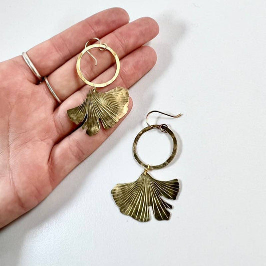 ginkgo earrings gold, ginkgo leaf jewelry, brass ginkgo earrings, gold hoop leaf earrings, gold filled ear wire earrings, hypoallergenic botanical earrings, nature inspired jewelry, ginkgo tree symbol earrings, handmade ginkgo earrings, raw brass botanical earrings, graceful gold dangle earrings, elegant leaf earrings, ginkgo hoop earrings, everyday gold earrings, artful nature earrings