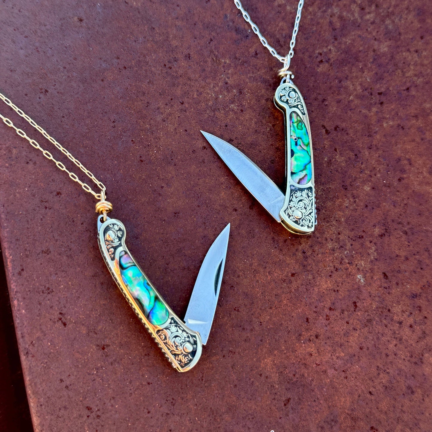 lennox necklace knife, mini knife necklace gold, abalone pocket knife jewelry, stealthy knife pendant, gold filled knife necklace, functional knife jewelry, filigree knife necklace, vintage inspired utility necklace, pocket knife necklace for women, adventurer jewelry, abalone shell pendant knife, necklace with hidden blade, fashionable self defense necklace, secret blade necklace, gold mini knife pendant