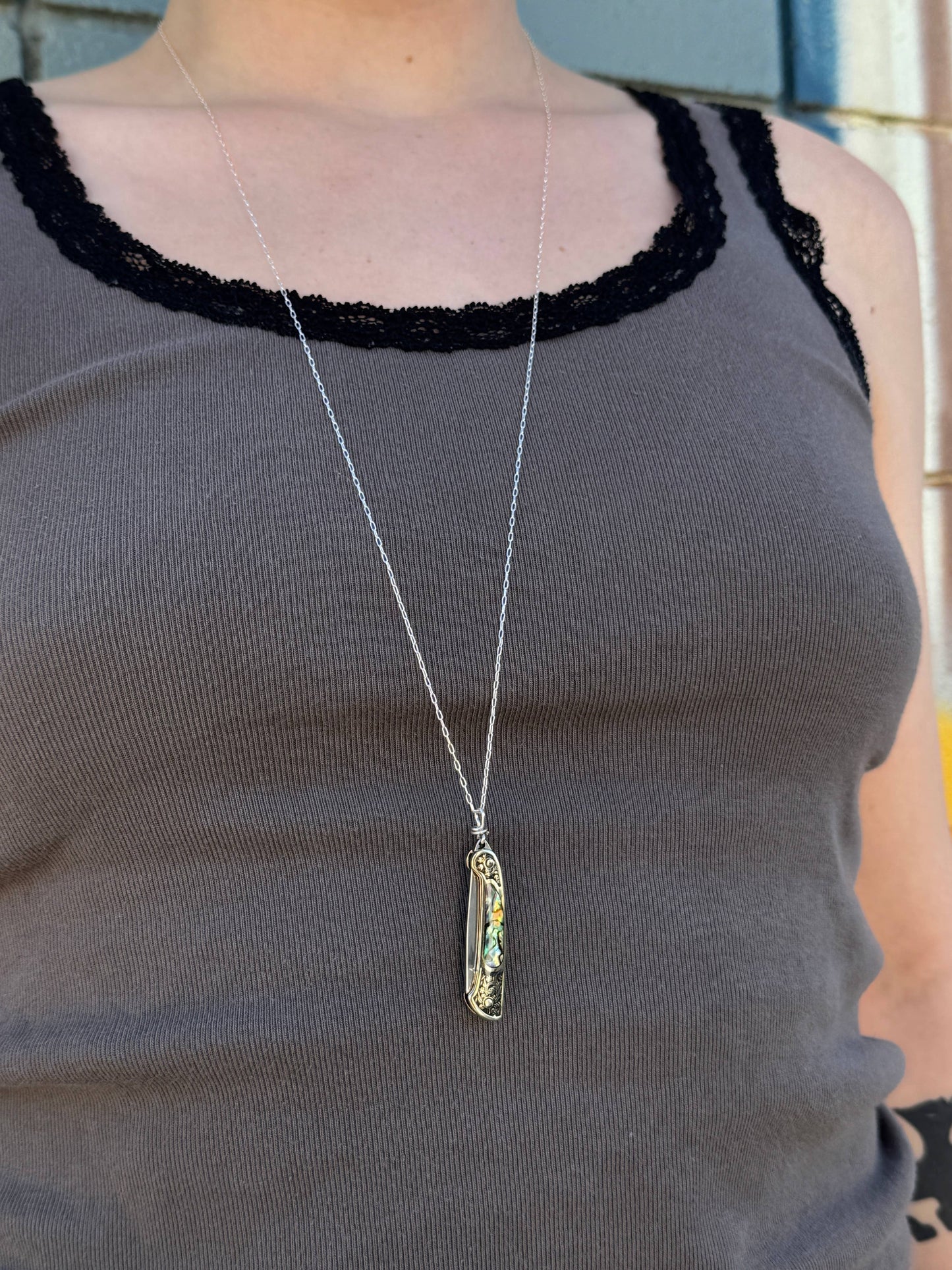 lennox necklace knife, mini knife necklace gold, abalone pocket knife jewelry, stealthy knife pendant, gold filled knife necklace, functional knife jewelry, filigree knife necklace, vintage inspired utility necklace, pocket knife necklace for women, adventurer jewelry, abalone shell pendant knife, necklace with hidden blade, fashionable self defense necklace, secret blade necklace, gold mini knife pendant