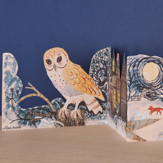 Detail of the Mark Hearld Silent Flight accordion card featuring a barn owl, woodland trees, and winter illustrations.