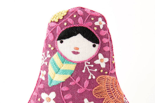 matryoshka embroidery kit, embroidered nesting doll craft, Kiriki Press embroidery, Level 3 embroidery pattern, DIY stitched doll, hand embroidery project, screen printed fabric kit, DMC floss embroidery, heritage-inspired sewing kit, handmade gift idea