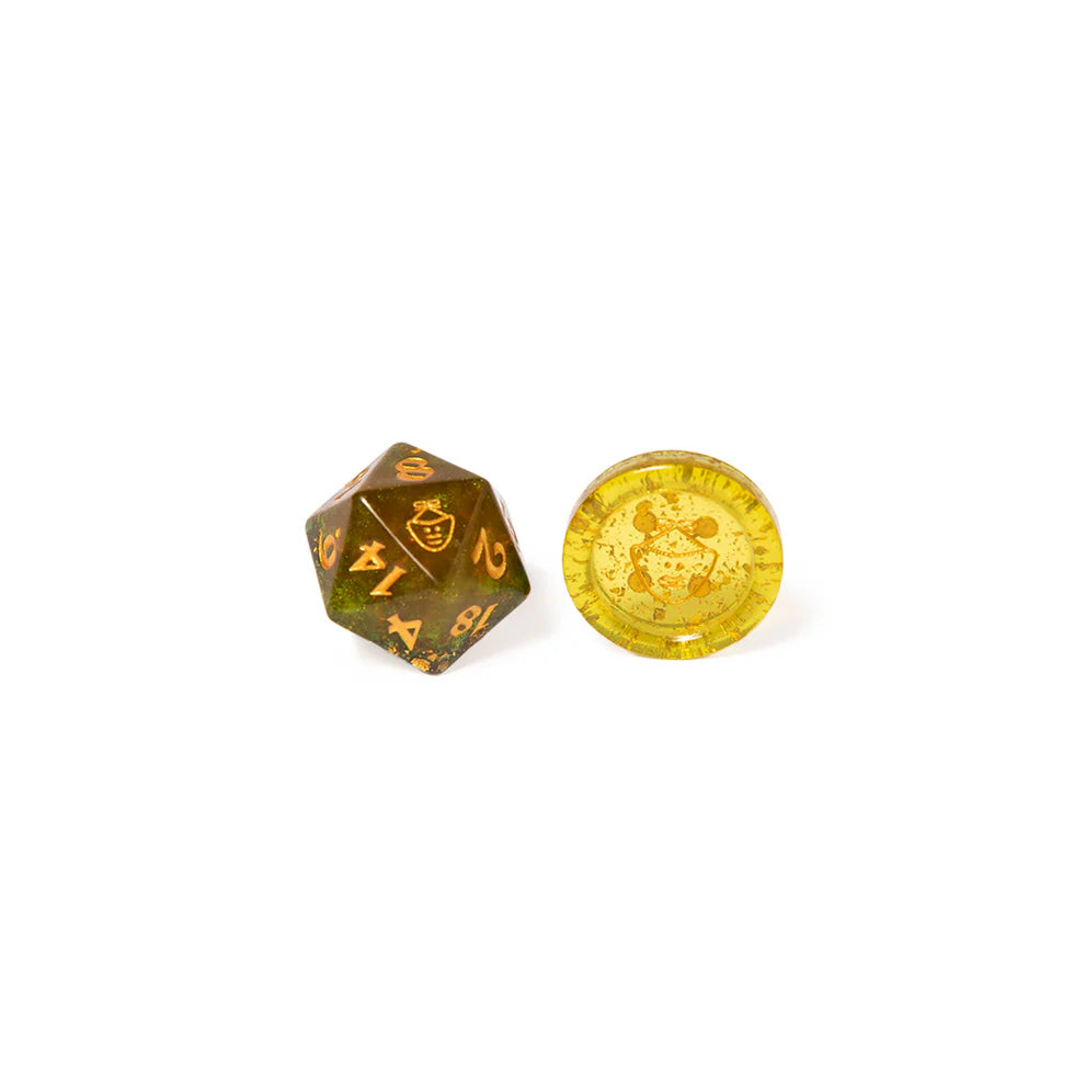 Nott the Brave dice set, Mighty Nein Critical Role dice, goblin-themed DnD dice, translucent green polyhedral dice, gold inked D20, Critical Role official dice, DnD dice with bronze specks, mask icon dice, Sam Riegel character dice, d2 button dice accessory