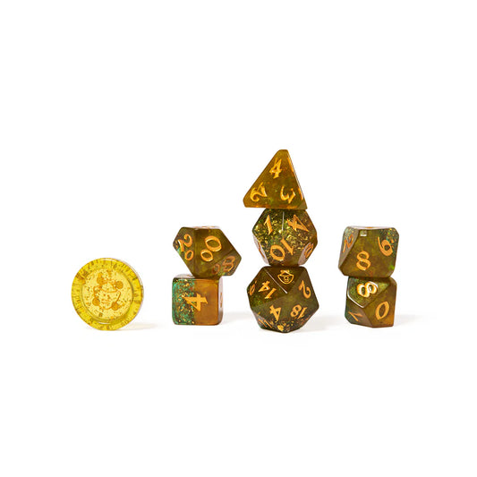 Nott the Brave dice set, Mighty Nein Critical Role dice, goblin-themed DnD dice, translucent green polyhedral dice, gold inked D20, Critical Role official dice, DnD dice with bronze specks, mask icon dice, Sam Riegel character dice, d2 button dice accessory