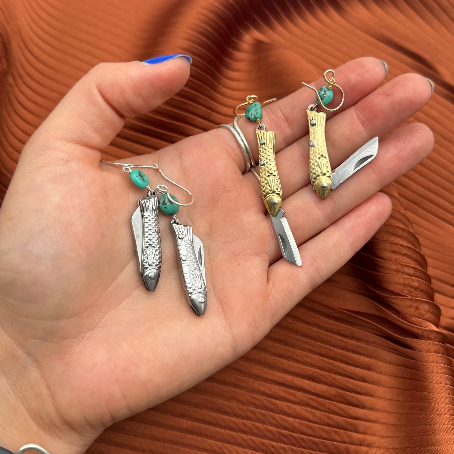 mini knife earrings, functional fashion earrings, rogue jewelry for gamers, fantasy cosplay earrings, high fashion gamer accessories, turquoise knife earrings, hidden blade earrings, stylish rpg gear, edgy earrings for women, gamer fashion accessories, dnd inspired jewelry, critical role style earrings, knife earrings real blade, tiny pocket knife earrings, fashion meets fantasy jewelry