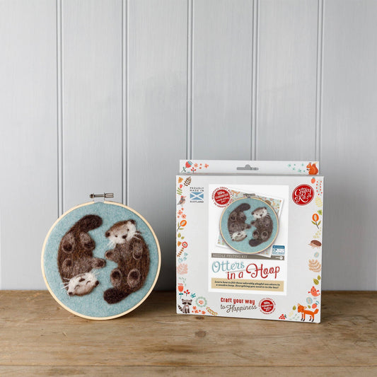 otters needle felting kit, otters in a hoop craft kit, painting with wool otters, beginner needle felting project, diy wool animal art, corriedale wool felting kit, 2d felting kit with hoop, otter wall art craft kit, crafty kit company otters, wool felt otter kit, felt animal couple project, scottish felting kits, embroidery hoop felt animals, felt otter gift idea, eco-friendly craft kit