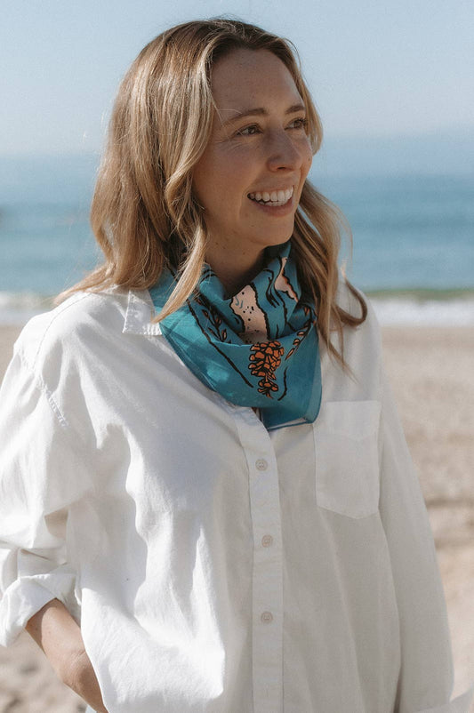 The Volcano and Sea Bandana by Bandits Bandanas features original artwork by Indonesian artist Fahrenno Asnawan. Made from Fair Trade Certified, 100% organic cotton, this soft, artist-designed bandana is perfect for styling at the neck, in the hair, or on a favorite bag. Each purchase gives back, with 10% of proceeds supporting Wahli Indonesia, making it a meaningful accessory rooted in art, ethics, and everyday wear.