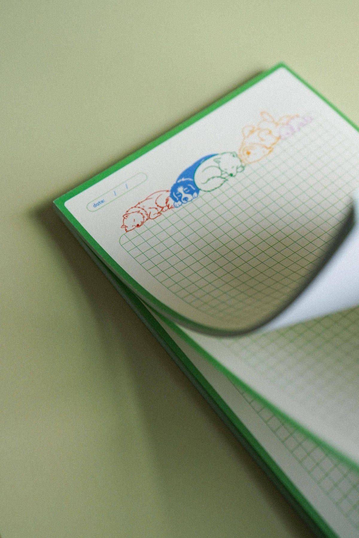 Ruff Drafts tear-off notepad showing the grid pages and cardboard backing