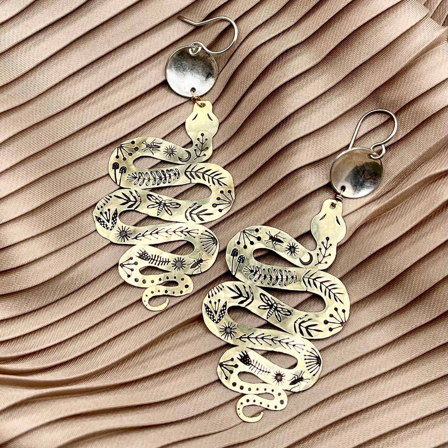 Slither, serpent and circle earrings, gold snake earrings, mythic jewelry for women, transformation symbol earrings, snake and silver earrings, mixed metal statement earrings, gold and silver dangle earrings, snake charm earrings, hypoallergenic serpent earrings, ancient symbol jewelry, ouroboros inspired earrings, spiritual transformation earrings, textured silver and gold earrings, sterling silver plated earrings, mystical boho jewelry