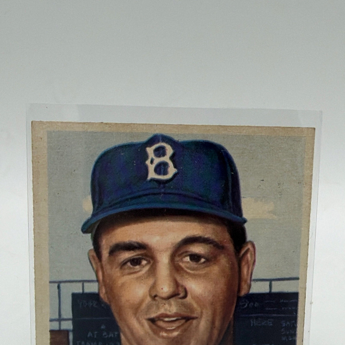 Close-up of Dick Williams wearing a Brooklyn Dodgers cap on his 1953 Topps #125 baseball card