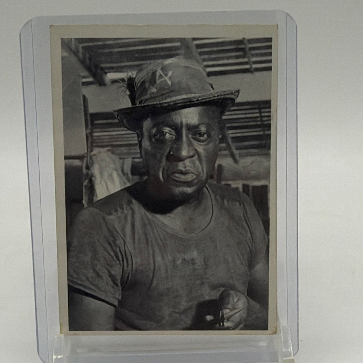 Front of 1965 James Bond 007 Secret Agent #5 Quarrel trading card featuring black-and-white portrait of John Kitzmiller