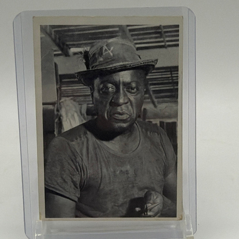 Front of 1965 James Bond 007 Secret Agent #5 Quarrel trading card featuring black-and-white portrait of John Kitzmiller