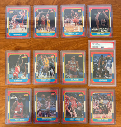Fronts of 1986 Fleer Basketball cards #61–72 from the complete 1986–87 Fleer Basketball set. Featured players include Bill Laimbeer #61, Allen Leavell #62, Lafayette Lever #63, Alton Lister #64, Lewis Lloyd #65, Maurice Lucas #66, Jeff Malone #67, PSA-graded Karl Malone rookie card #68, Moses Malone #69, Cedric Maxwell #70, Rodney McCray #71, and Xavier McDaniel #72. Key Hall of Famers Karl Malone, Moses Malone, Maurice Lucas, and Bill Laimbeer highlight this section of the iconic 1986 Fleer Basketball rele