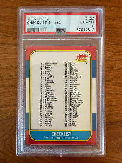 1986 Fleer Basketball Checklist card #132 graded PSA 6 (EX-MT). The iconic checklist card features the player checklist for cards #1–66 from the legendary 1986–87 Fleer Basketball set, including Hall of Fame stars such as Michael Jordan, Larry Bird, Magic Johnson, Charles Barkley, Julius Erving, Kareem Abdul-Jabbar, and Patrick Ewing. Encapsulated in an authenticated PSA holder.