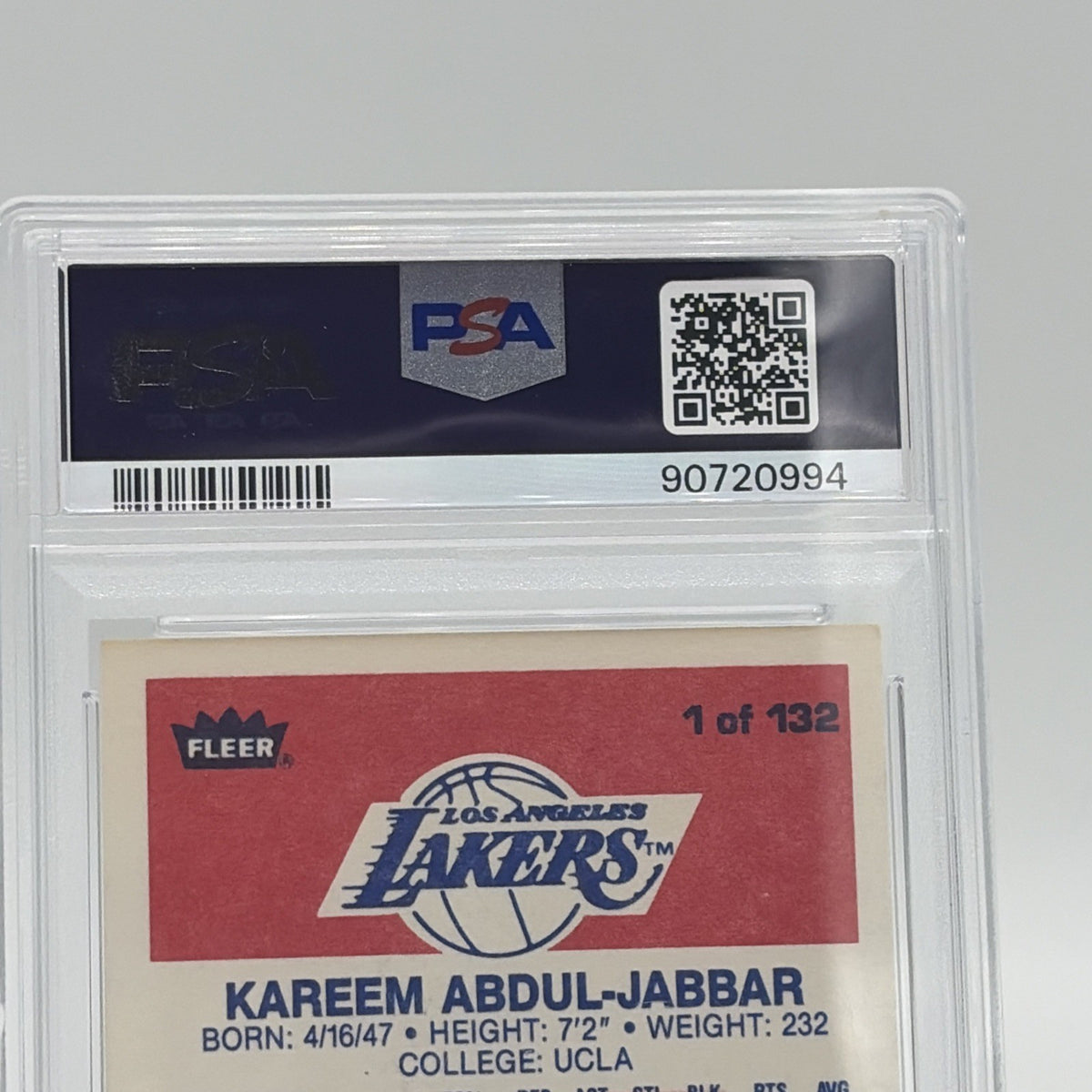 Close-up of the PSA EX-MT 6 certification label on a 1986 Fleer Kareem Abdul-Jabbar #1 basketball card.