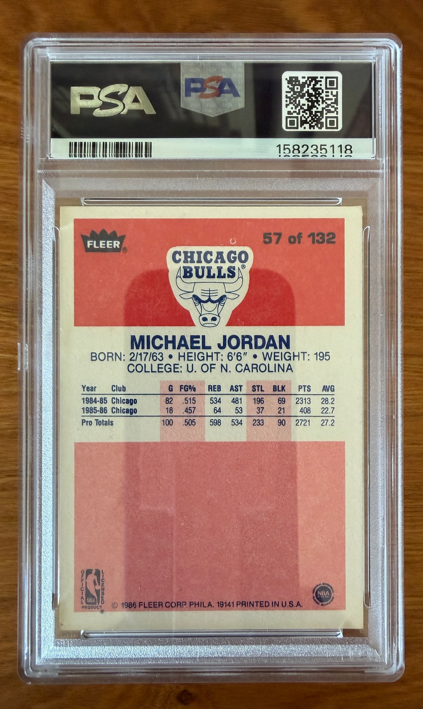 Back of the 1986 Fleer Michael Jordan rookie card #57 graded PSA 5.5 (EX+). The card back features Jordan's biographical information, early Chicago Bulls statistics, University of North Carolina reference, and the Chicago Bulls logo. Encapsulated in an authenticated PSA holder with certification number visible.