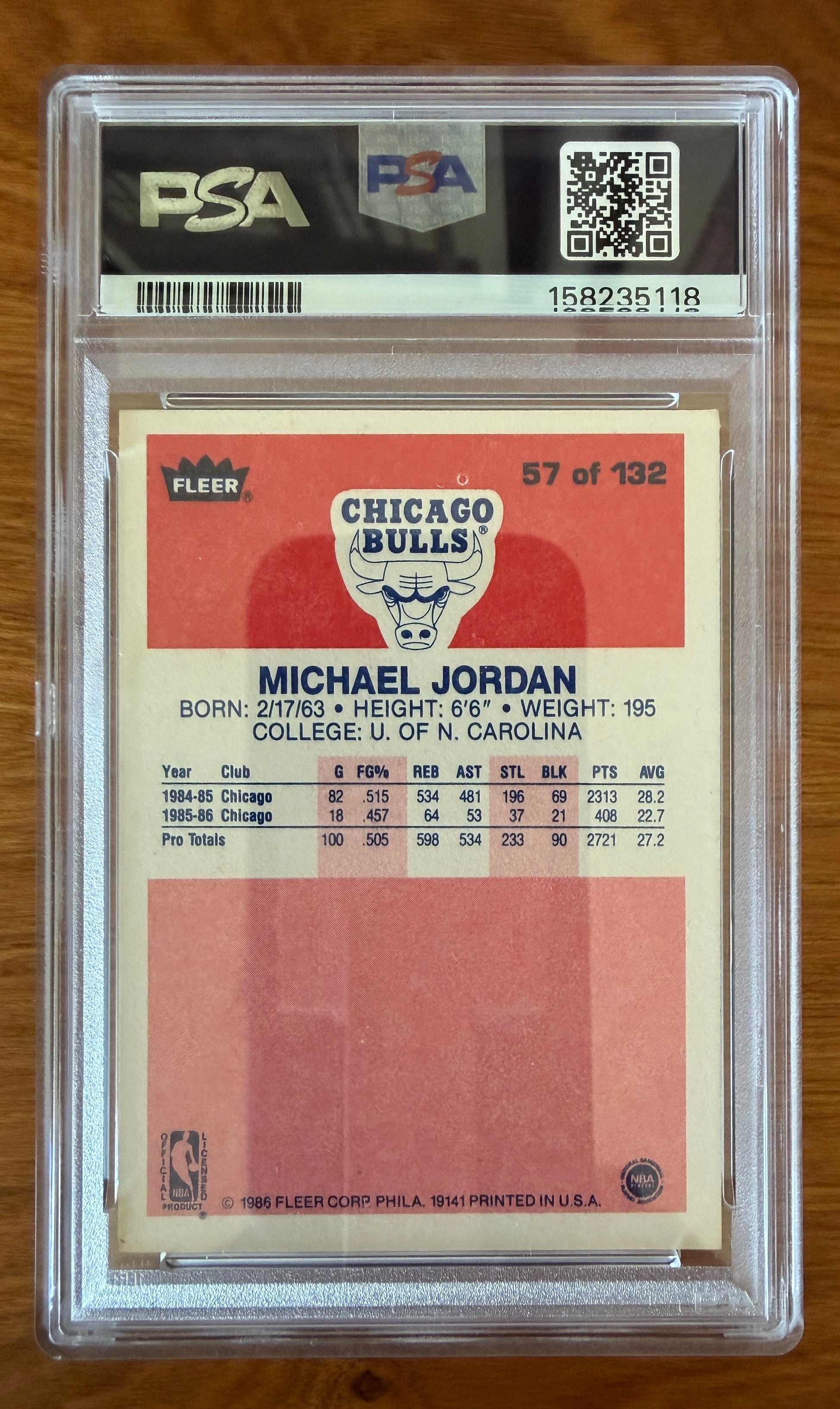 Back of the 1986 Fleer Michael Jordan rookie card #57 graded PSA 5.5 (EX+). The card back features Jordan's biographical information, early Chicago Bulls statistics, University of North Carolina reference, and the Chicago Bulls logo. Encapsulated in an authenticated PSA holder with certification number visible.