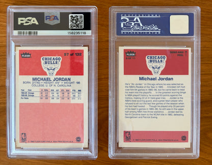 Backs of Michael Jordan's 1986 Fleer rookie card #57 PSA 5.5 and 1986 Fleer sticker #8 PSA 7 displayed side by side. The rookie card back features Jordan's early Chicago Bulls statistics and biographical information, while the sticker back includes a player profile highlighting his Rookie of the Year season and collegiate career at North Carolina. Both are encapsulated in authenticated PSA holders.