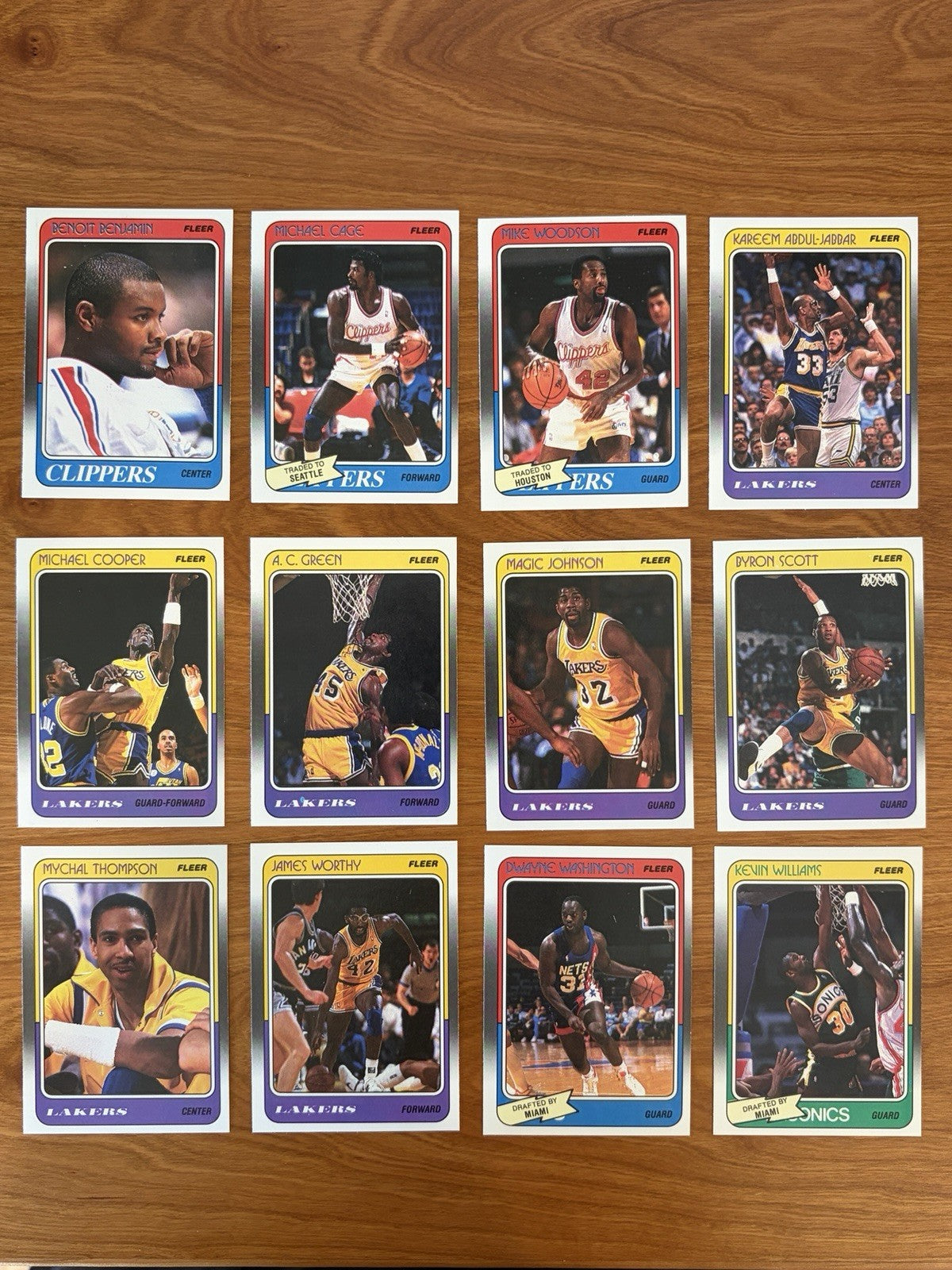 Los Angeles Lakers player cards from the 1988 Fleer Basketball complete collection featuring Magic Johnson, James Worthy, Byron Scott, and Kareem Abdul-Jabbar.