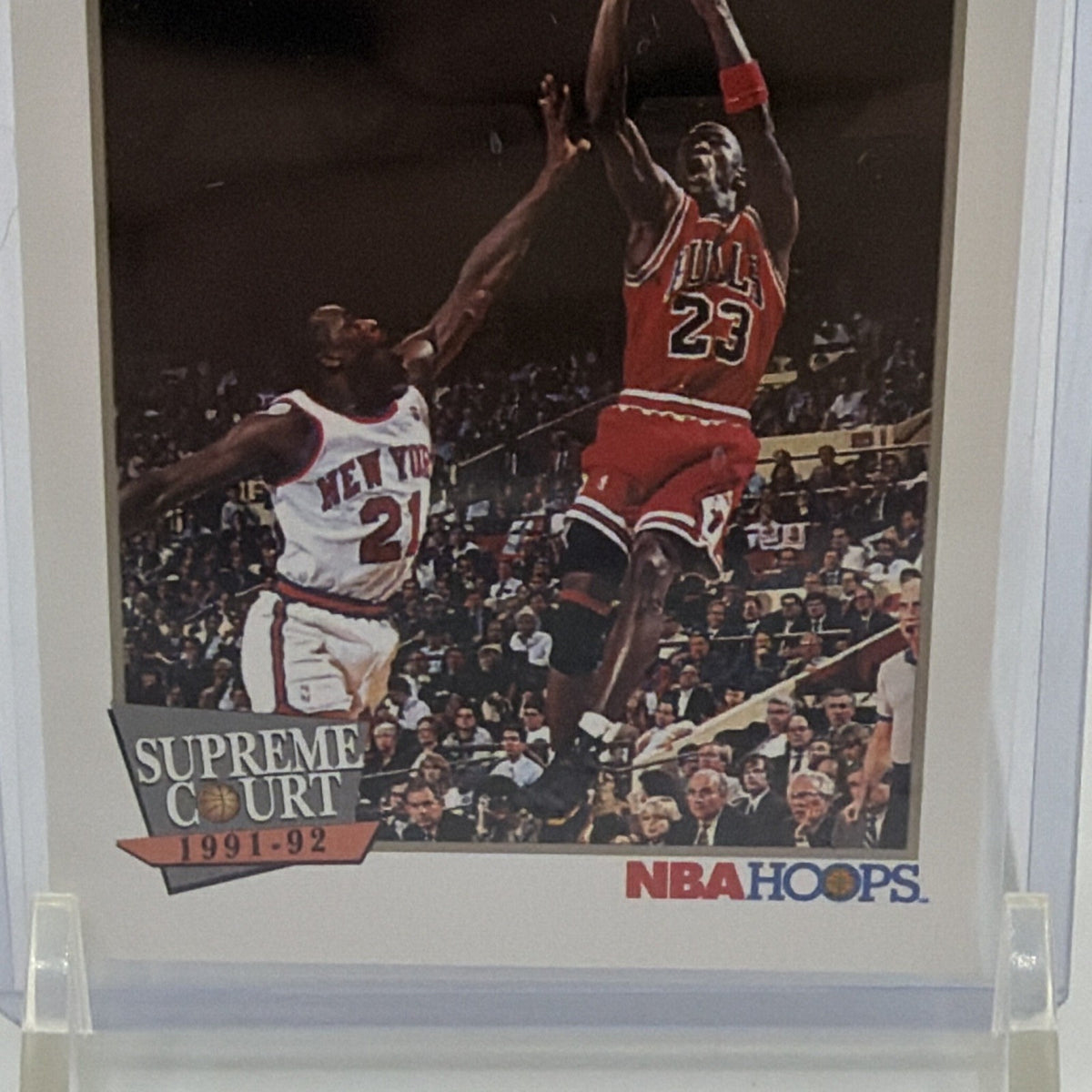 Detail of Michael Jordan shooting over a defender in Chicago Bulls uniform