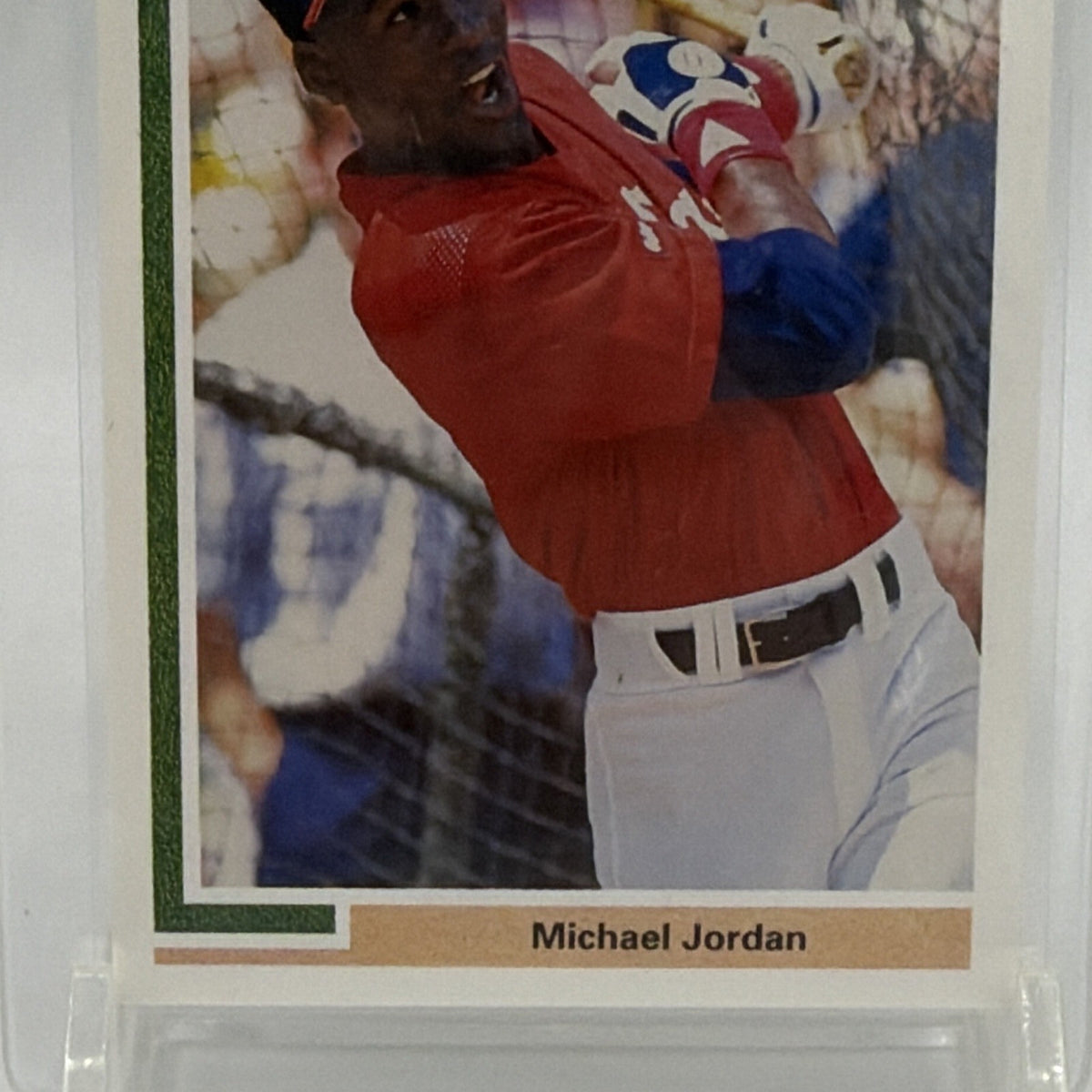 Detail of Michael Jordan baseball card showing his batting stance and printed nameplate
