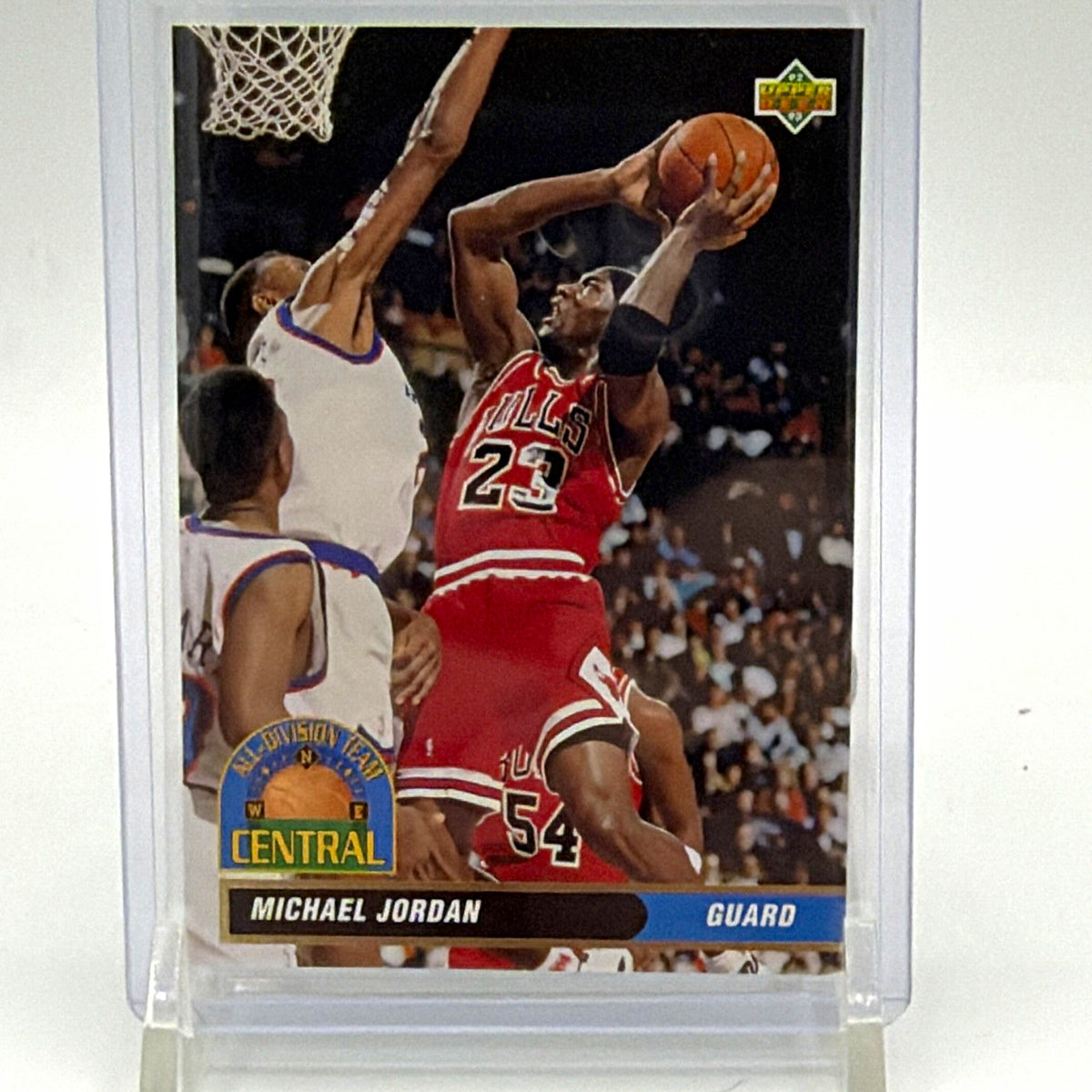 Front of 1992–93 Upper Deck Michael Jordan All-Division Team #AD9 basketball card showing Jordan in a red Chicago Bulls uniform