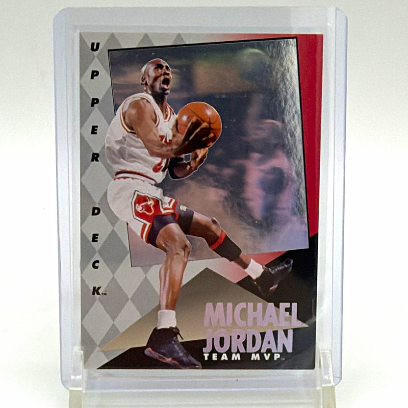 Front of 1992–93 Upper Deck Michael Jordan Team MVP Holograms #4 basketball card featuring Jordan in a white Chicago Bulls uniform holding a basketball