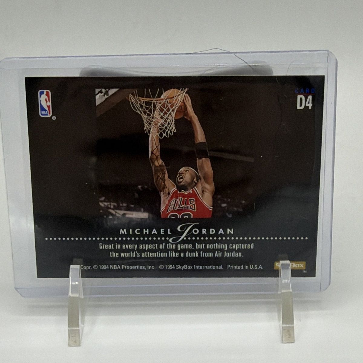 Reverse of Michael Jordan Dynamic Dunks D4 card featuring Chicago Bulls action photography and printed card information