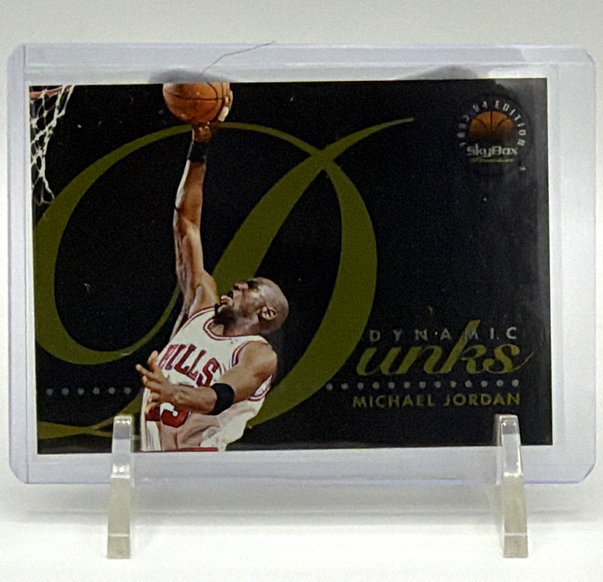 Front of 1993–94 SkyBox Premium Michael Jordan Dynamic Dunks D4 insert card showing Jordan in a Chicago Bulls uniform reaching toward the basket