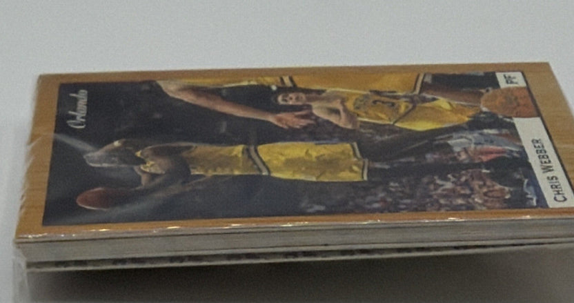 Side view showing thickness of the packaged basketball card set and protective case