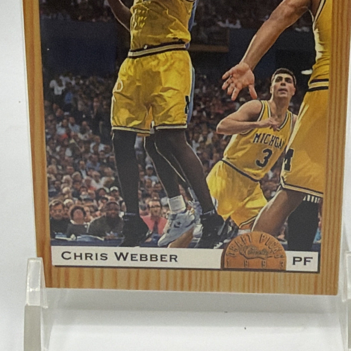 Close-up of Chris Webber card showing basketball action photography and woodgrain design
