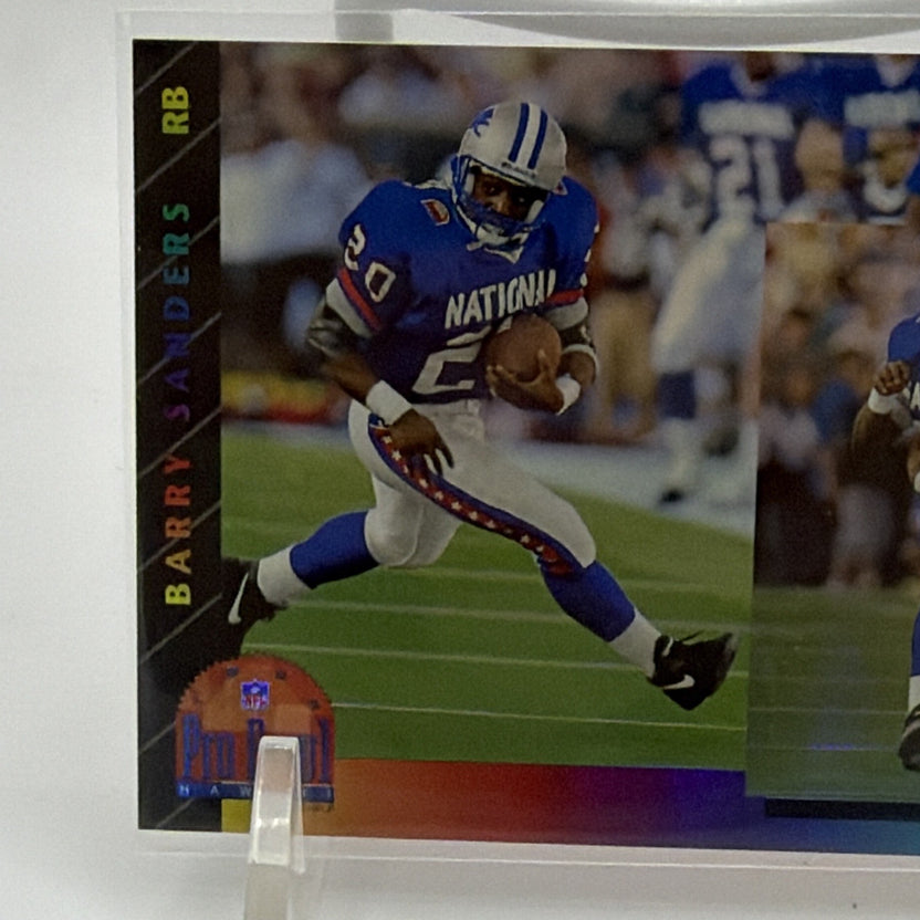 Close-up of Barry Sanders running with the football in his blue NFC Pro Bowl uniform