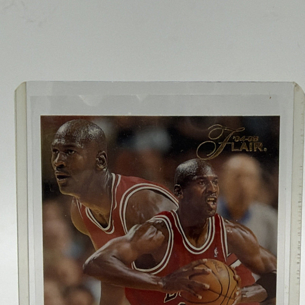 Upper front detail of Michael Jordan in Chicago Bulls #45 uniform on 1994-95 Flair card