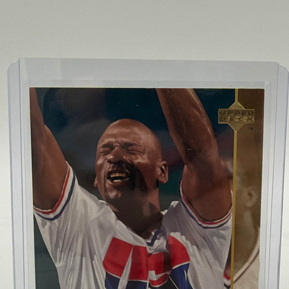 Close-up of Michael Jordan with arms raised in his USA Basketball uniform on the 1994 Upper Deck card